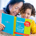 Image of grandma with her grandchild looking over a recipe book with special family stories and holiday recipes.